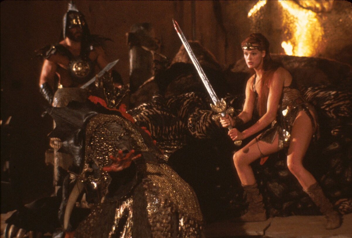 Обложка: кадр из фильма «Рыжая Соня» 1985 года